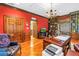 Large home office with custom shelving, wet bar, and herringbone wood flooring at 1628 Long Bow Ln, Clearwater, FL 33764