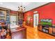 Home office with custom built-in shelving, a wet bar, and a classic design at 1628 Long Bow Ln, Clearwater, FL 33764