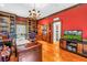 Home office with custom built-in shelving, a wet bar, and a classic design at 1628 Long Bow Ln, Clearwater, FL 33764