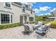 Charming outdoor patio featuring comfortable seating amidst lush landscaping at 1628 Long Bow Ln, Clearwater, FL 33764