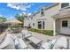 A spacious patio with outdoor seating offers relaxation and entertainment space next to the home at 1628 Long Bow Ln, Clearwater, FL 33764