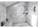 Luxurious shower with marble walls, built-in bench, and rain shower head at 1628 Long Bow Ln, Clearwater, FL 33764