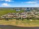Extensive aerial view of the neighborhood and surrounding area with golf course at 2049 Skimmer W Ct # 311, Clearwater, FL 33762