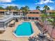 Aerial view of the community pool, lounge chairs, umbrellas and common areas at 2049 Skimmer W Ct # 311, Clearwater, FL 33762