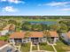 Aerial view of the condominiums overlooking the lush golf course and serene lake at 2049 Skimmer W Ct # 311, Clearwater, FL 33762