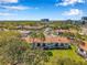 Aerial view of condominiums with beautiful landscaping and tree coverage at 2049 Skimmer W Ct # 311, Clearwater, FL 33762