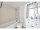 Cozy bathroom with a shower-tub combination and single vanity at 2049 Skimmer W Ct # 311, Clearwater, FL 33762