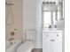 Bathroom with tiled shower/tub, a modern vanity, and neutral color palette at 2049 Skimmer W Ct # 311, Clearwater, FL 33762