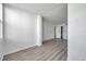 A bedroom features modern gray wood flooring, white walls, and a closet at 2049 Skimmer W Ct # 311, Clearwater, FL 33762