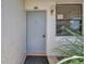 Close-up of the condo's front door with a neutral color and good lighting at 2049 Skimmer W Ct # 311, Clearwater, FL 33762