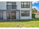 Exterior view of the house with screened in patio and second story deck at 2049 Skimmer W Ct # 311, Clearwater, FL 33762