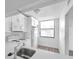 Recently renovated kitchen featuring updated appliances, countertop and large window at 2049 Skimmer W Ct # 311, Clearwater, FL 33762