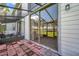 Enclosed patio with views of the lush green backyard and golf course at 2049 Skimmer W Ct # 311, Clearwater, FL 33762