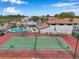 Aerial view of the tennis court with the community pool and parking area in the background at 2049 Skimmer W Ct # 311, Clearwater, FL 33762