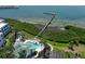 Aerial view of community pool and pier with waterfront access and dock at 2201 Bay Club Cir, Tampa, FL 33607