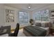 Inviting bedroom with a dedicated workspace, featuring a bright window view and a cozy, neutral-toned aesthetic at 2201 Bay Club Cir, Tampa, FL 33607