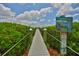 Picturesque boardwalk surrounded by lush vegetation, offering a tranquil path to the waterfront at 2201 Bay Club Cir, Tampa, FL 33607