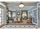 Elegant dining room featuring a fireplace, large windows, and stylish furnishings for comfortable entertaining at 2201 Bay Club Cir, Tampa, FL 33607