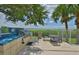 Community outdoor grill area and kitchen with a view of the waterfront at 2201 Bay Club Cir, Tampa, FL 33607