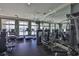 Community gym with modern equipment, mirrors, and large windows with scenic views at 2201 Bay Club Cir, Tampa, FL 33607