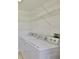 Laundry room featuring white appliances and wire shelving at 2201 Bay Club Cir, Tampa, FL 33607