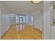 Spacious living room featuring hardwood floors and a bright ambiance, seamlessly flowing into the kitchen and dining areas at 2201 Bay Club Cir, Tampa, FL 33607