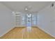 Bright living room with hardwood floors, ceiling fan and built-in shelving at 2201 Bay Club Cir, Tampa, FL 33607