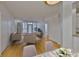 Elegant living room with hardwood floors and access to a balcony, seamlessly connected to the dining area and kitchen at 2201 Bay Club Cir, Tampa, FL 33607
