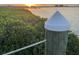 View of the pier edge showing natural foliage and peaceful waterfront setting, perfect for relaxing at 2201 Bay Club Cir, Tampa, FL 33607