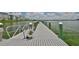 Waterfront pier offering a relaxing spot with railings, and breathtaking views of the surrounding landscape at 2201 Bay Club Cir, Tampa, FL 33607