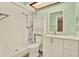 Clean and bright bathroom with a shower, vanity, and mirror, offering a fresh and functional space at 2515 Pemberton Creek Dr, Seffner, FL 33584