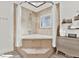 Well-lit bathroom featuring a tub with shower, a window, and a modern vanity with drawers and storage at 2515 Pemberton Creek Dr, Seffner, FL 33584