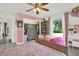 Charming bedroom with a view to the closet and a window overlooking the yard at 2515 Pemberton Creek Dr, Seffner, FL 33584