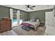 Cozy bedroom with pool access, dresser, and soft rug at 2515 Pemberton Creek Dr, Seffner, FL 33584