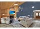 Bright living room with stone fireplace, wood-paneled ceiling, comfortable seating, and stylish decor at 2515 Pemberton Creek Dr, Seffner, FL 33584