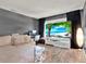 Stylish living room with a large screen, comfortable sofa, and modern decor at 2515 Pemberton Creek Dr, Seffner, FL 33584