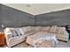 Cozy living room with a large sectional sofa, comfortable pillows, and a soft throw blanket at 2515 Pemberton Creek Dr, Seffner, FL 33584