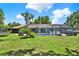 Beautiful screened-in pool area with a spa and ample space for lounging and entertaining at 2515 Pemberton Creek Dr, Seffner, FL 33584