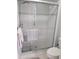 Bathroom with a glass shower and tile walls at 2588 Laurelwood Dr # 16A, Clearwater, FL 33763