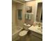 Bathroom with tub and shower combo, toilet, sink and vanity at 2588 Laurelwood Dr # 16A, Clearwater, FL 33763