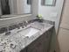 Bathroom featuring granite countertops, modern vanity, and framed mirror at 2588 Laurelwood Dr # 16A, Clearwater, FL 33763