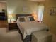 Comfortable bedroom with neutral tones, carpeted flooring, ceiling fan, and coordinated furnishings at 2588 Laurelwood Dr # 16A, Clearwater, FL 33763