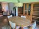 Open dining area with a dining table set beneath the light fixture and storage at 2588 Laurelwood Dr # 16A, Clearwater, FL 33763