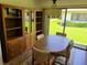 Dining area next to a window with a view of the greenery outside at 2588 Laurelwood Dr # 16A, Clearwater, FL 33763