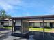 Apartment complex with covered parking and manicured lawn at 2588 Laurelwood Dr # 16A, Clearwater, FL 33763