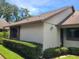 Home exterior with well-maintained lawn and tidy landscaping around the base at 2588 Laurelwood Dr # 16A, Clearwater, FL 33763