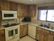 Functional kitchen with appliances, ample counter space, and natural light at 2588 Laurelwood Dr # 16A, Clearwater, FL 33763