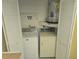 Laundry closet equipped with a washer, dryer, and water heater at 2588 Laurelwood Dr # 16A, Clearwater, FL 33763