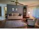 Inviting living room featuring a comfortable sofa, ceiling fan, and hardwood floors at 2588 Laurelwood Dr # 16A, Clearwater, FL 33763
