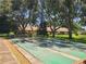 Outdoor shuffleboard courts surrounded by trees at 2588 Laurelwood Dr # 16A, Clearwater, FL 33763